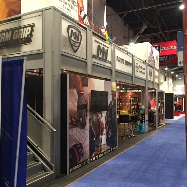 Long double deck trade show design with graphics